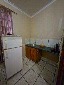 Η κουζίνα ή μικρή κουζίνα στο Vegkop Gaste Huis - B&B +15 φωτογραφίες