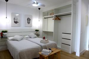 Posteľ alebo postele v izbe v ubytovaní Durmiendo sobre el mar, Vivienda La Baja Grande