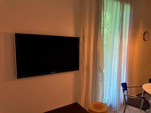 TV a/nebo společenská místnost v ubytování Appartamento Dolly Villorba + 10 fotografií