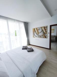 A bed or beds in a room at Smart Conzept 2bdr