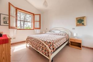 Postel nebo postele na pokoji v ubytování Villa Caletta Feraxi-Muravera 3 minuti dal mare