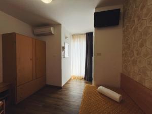 TV a/nebo společenská místnost v ubytování Hotel Ramona