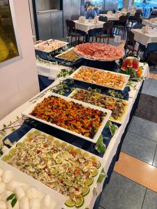 a buffet line with many different types of food at Hotel Luna in Bibione +91 photos