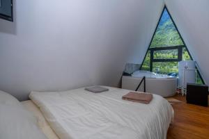 Postel nebo postele na pokoji v ubytování Arditi's Chalets