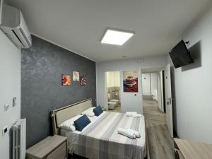 TV a/nebo společenská místnost v ubytování Siclari B&B-Rooms&Suite