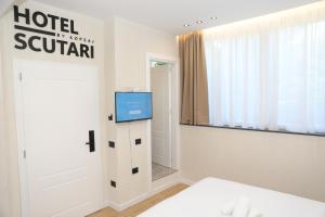 Postel nebo postele na pokoji v ubytování Hotel Scutari