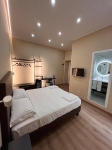 Postel nebo postele na pokoji v ubytování Colosseum Deluxe