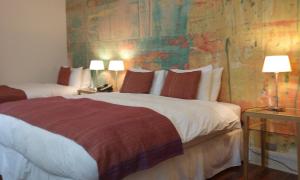 Rúm í herbergi á Matildas Hotel Boutique