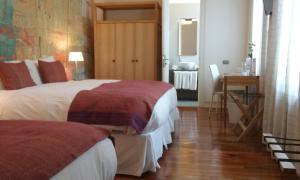 Rúm í herbergi á Matildas Hotel Boutique