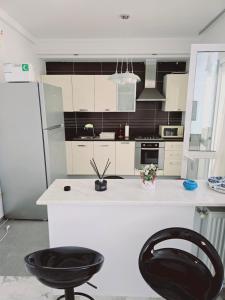 Cucina o angolo cottura di Karray Home Appartement Salon 2 RDC avec Jardin