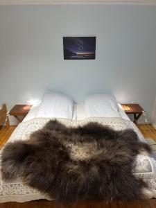 Ένα ή περισσότερα κρεβάτια σε δωμάτιο στο Arctic Ocean Lodge