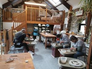 a group of people sitting at tables in a room at Siramik in Carmarthen