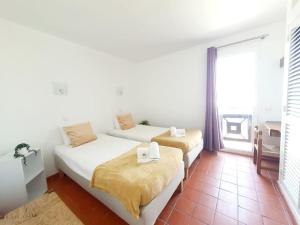 Ένα ή περισσότερα κρεβάτια σε δωμάτιο στο Apartamento do Moinho acesso à Piscina +25 φωτογραφίες