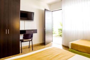Łóżko lub łóżka w pokoju w obiekcie Hotel Manantial Melgar