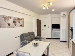 a living room with a couch and a table at Family Stylish Apartment in Norcia