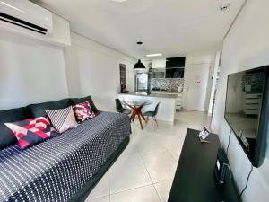 a living room with a couch and a table at Landscape Diamond 1409 in Fortaleza