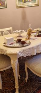 a table with a plate of food on it at Enza Domus in Bari