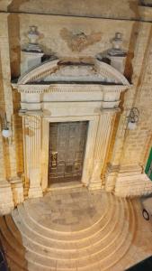 a large room with a large door in a building at Enza Domus in Bari