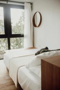 Postel nebo postele na pokoji v ubytování Mata e' Platano Guesthouse