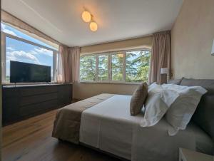 Postel nebo postele na pokoji v ubytování Quarto di Monte Suite & Spa