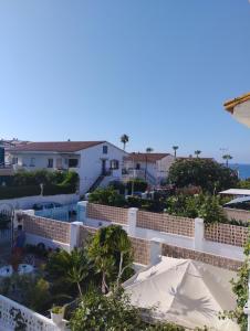 a view from the balcony of a house at Villa Jade Beach in Cala del Moral