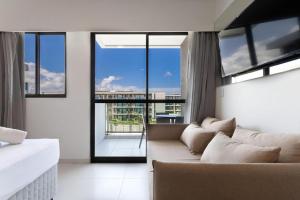 Μια τηλεόραση ή/και κέντρο ψυχαγωγίας στο Makia Beach Encantador A-219 - Em Muro Alto