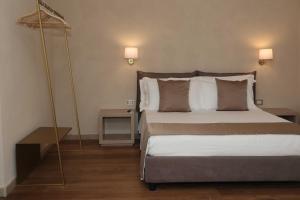 Postel nebo postele na pokoji v ubytování Quarto di Monte Suite & Spa + 37 fotografií