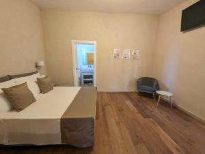 TV a/nebo společenská místnost v ubytování Quarto di Monte Suite & Spa