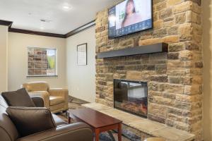 TV a/nebo společenská místnost v ubytování Cobblestone Hotel & Suites - Alpine
