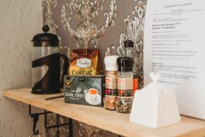 a shelf with some food items on it at Old Town Private Room, Shared Bath - D in Tallinn +22 photos