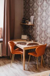 a table and two chairs in a room at Old Town Private Room, Shared Bath - D in Tallinn