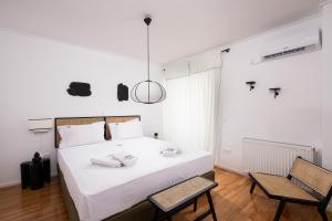 Postelja oz. postelje v sobi nastanitve Glyfada First Class Suite