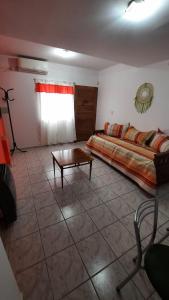 a bedroom with a bed and a coffee table at Mi Rincon in San Rafael