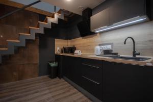 Kuchyň nebo kuchyňský kout v ubytování CORU House