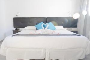 Postel nebo postele na pokoji v ubytování Hotel Portmán