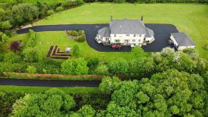 an aerial view of a large house with a yard at Greenmile House, in Kilmeaden