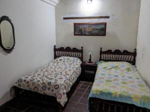 Ένα ή περισσότερα κρεβάτια σε δωμάτιο στο Casa Trespalacios