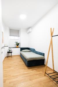 Un pat sau paturi într-o cameră la Casa G: Design apartment +22 fotografii