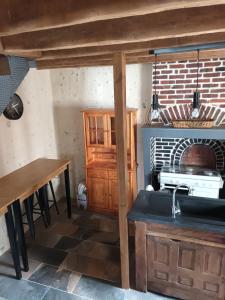 a kitchen with a sink and a stove at Le BENEZE entre Beauce et Perche in Saint-Hilaire-sur-Yerre