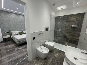 Koupelna v ubytování GRA' Suite Deluxe