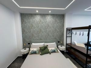 Postel nebo postele na pokoji v ubytování GRA' Suite Deluxe