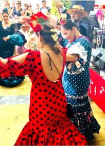 two women in polka dot dresses are dancing at Beachside Luxury Apartment in Puerto Banus - Club Playas del Duque in Marbella +101 photos