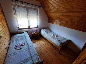 Postel nebo postele na pokoji v ubytování Eco Village Podgora Household Kaljevic