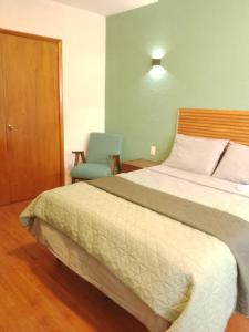 Llit o llits en una habitació de Casa IAIA 3 fotos més