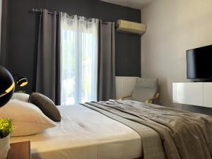 Ένα ή περισσότερα κρεβάτια σε δωμάτιο στο Sunny Garden Apartment