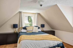 a bedroom with a bed and a window at Riverwood Retreat in West Linn