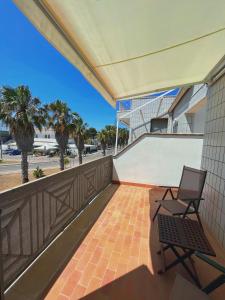 a balcony with a chair and a skateboard ramp at FronteMare in San Cataldo