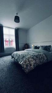Katil atau katil-katil dalam bilik di Lansdowne Apartments