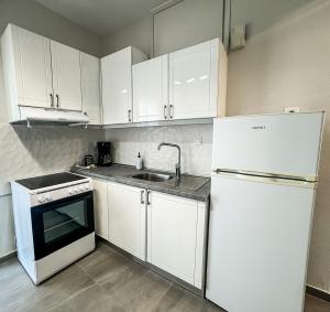 Kuchyň nebo kuchyňský kout v ubytování G&G Seaside Apartment