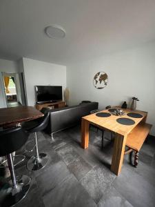 TV a/nebo společenská místnost v ubytování Appartement en lisière de forêt + 8 fotografií